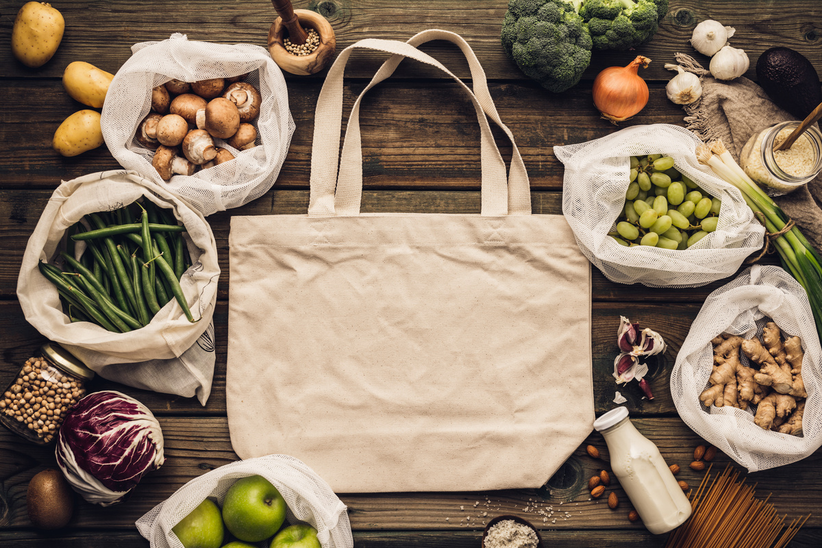 Eco-Friendly Food Shopping  Bag with Produce on Wooden Table